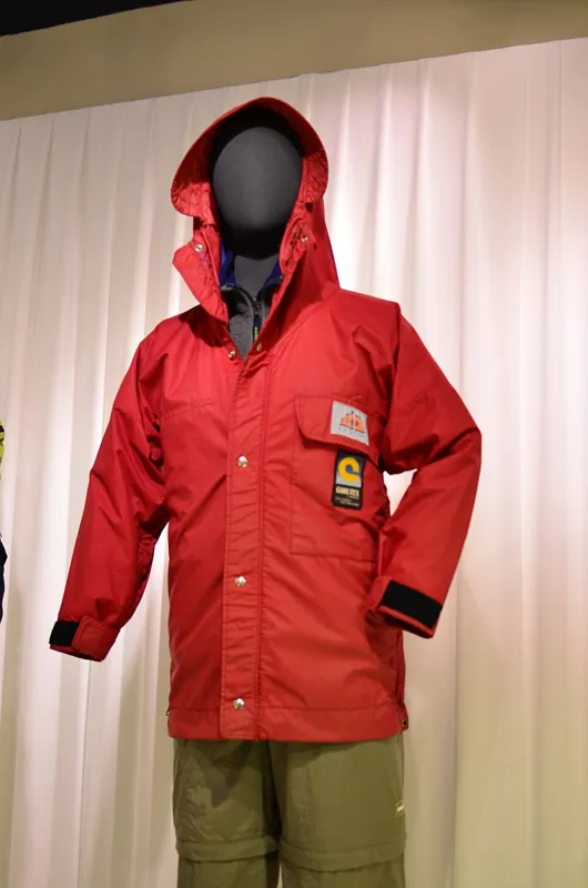 Red hooded rain jacket illustrating the rain jacket and pants rental listing in El Chaltén